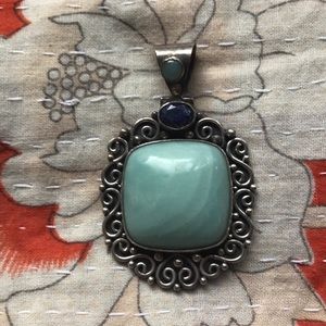 Sterling silver pendant with large larimar stone.